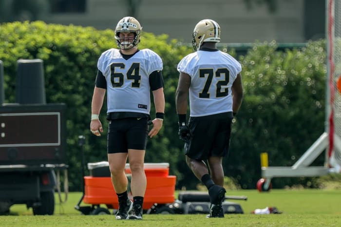 New Orleans Saints center Will Clapp (64) and tackle Terron Armstead (72) look on during a training camp session. Mandatory Credit: Stephen Lew-USA TODAY Sports